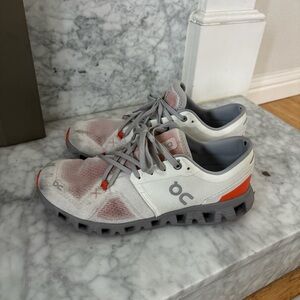 On Cloud Sneakers in White, Gray, and Orange